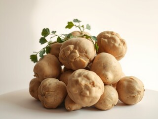 A still life composition featuring a basket overflowing with freshly dug potatoes, their rough, earthy skin glistening with dew