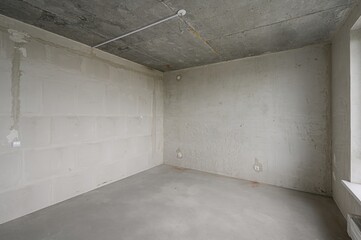 rough repairs for self-finishing. interior decoration, bare walls of the room, stage of...