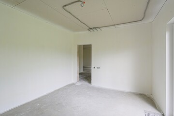 rough repairs for self-finishing. interior decoration, bare walls of the room, stage of...