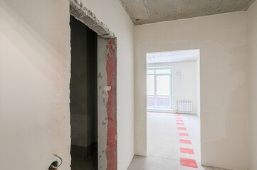 rough repairs for self-finishing. interior decoration, bare walls of the room, stage of...