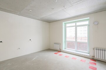 rough repairs for self-finishing. interior decoration, bare walls of the room, stage of...