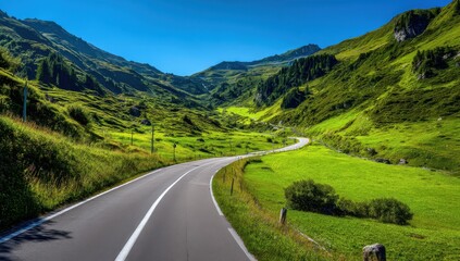 Fototapeta premium Serpentine mountain road winding through lush green alpine meadows under a vibrant blue sky, offering a scenic driving experience. : Generative AI