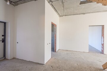 rough repairs for self-finishing. interior decoration, bare walls of the room, stage of construction. interior apartment room.