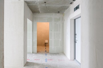 rough repairs for self-finishing. interior decoration, bare walls of the room, stage of construction. interior apartment room.
