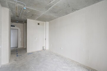 rough repairs for self-finishing. interior decoration, bare walls of the room, stage of...