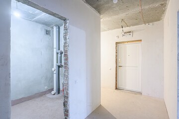 rough repairs for self-finishing. interior decoration, bare walls of the room, stage of...