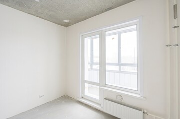 rough repairs for self-finishing. interior decoration, bare walls of the room, stage of...