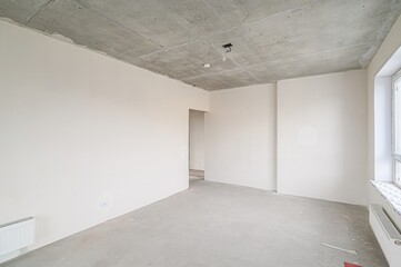 rough repairs for self-finishing. interior decoration, bare walls of the room, stage of...