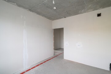 rough repairs for self-finishing. interior decoration, bare walls of the room, stage of construction. interior apartment room.