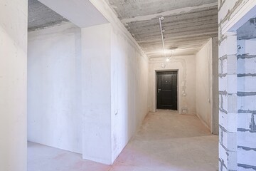 rough repairs for self-finishing. interior decoration, bare walls of the room, stage of...
