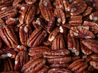 raw organic pecan nuts pattern background.