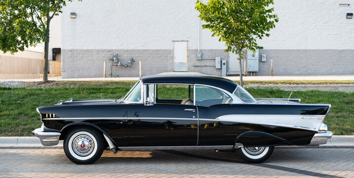 Park Ridge, Illinois, USA - August 22, 2024: Black car of Chevrolet Bel Air . 1957 Chevy Bel Air. Black car parked outdoor at auto show, side view. Chevrolet Bel Air retro car.