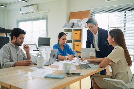 Financial professionals analyzing business data in office meeting, focusing on revenue, budgeting, and long-term success planning performance analysis, investment ideas, and profit growth targets