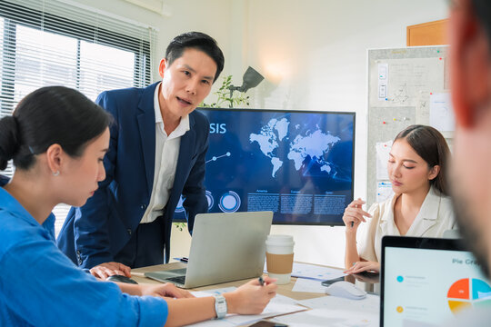 Financial professionals analyzing business data in office meeting, focusing on revenue, budgeting, and long-term success planning performance analysis, investment ideas, and profit growth targets