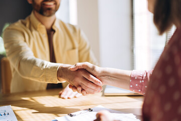 Business people shaking hands after successful meeting in office