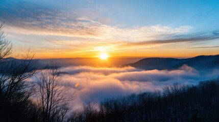 Obraz premium Majestic sunrise over a sea of clouds, casting a warm golden light on the mountain landscape. Bare winter trees silhouette against the vibrant sky. : Generative AI