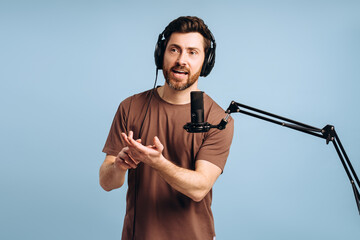Content creator recording podcast wearing headphones and speaking into microphone