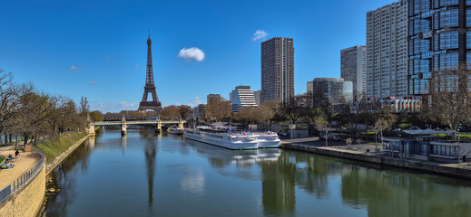 Naklejka premium Eiffel Tower And River Seine With Ferry Boats In The City Of Paris In France
