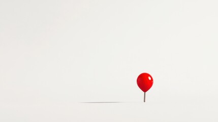 Red Pushpin on White Background