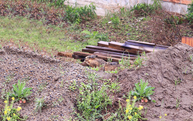 Two hares in the rain near a construction site...