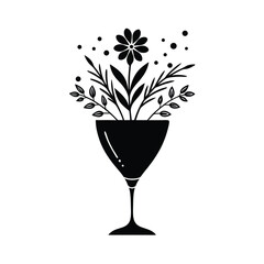 Elegant black and white floral arrangement in a cocktail glass depicting nature and modern art