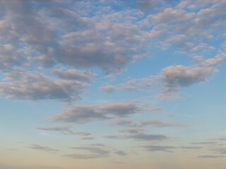 Obraz premium Celestial Canvas: Sunset-Illuminated Cloud Kingdom from Above