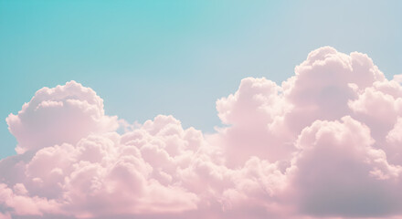 Fluffy Pink Clouds against a Bright Blue Sky Creating a Dreamy Ethereal Pastel Background