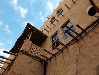 Traditional architecture in the Old City district in Dubai against the blue sky