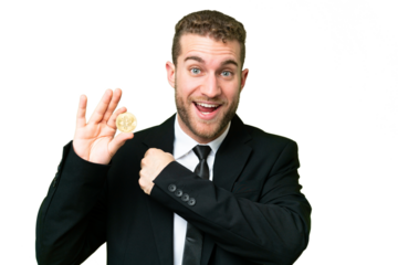 Young business blonde man holding a Bitcoin over isolated chroma key background celebrating a victory