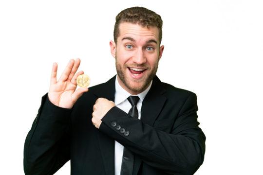 Young business blonde man holding a Bitcoin over isolated chroma key background celebrating a victory
