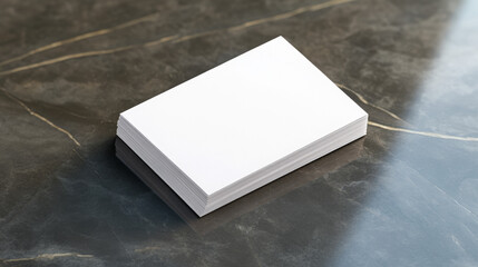 Fototapeta premium Blank business card mockup on a marble surface 