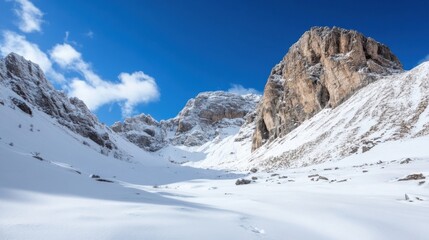 Majestic snow-covered mountain peaks rise under a vibrant blue sky, showcasing a breathtaking winter landscape in a serene valley. : Generative AI
