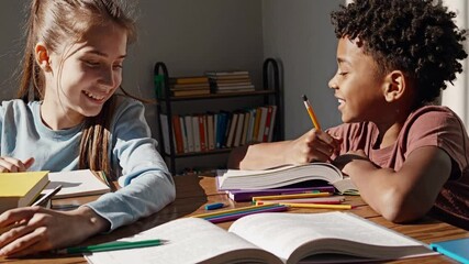 Young students working together, solving math problems with focused concentration and shared enthusiasm while developing learning skills at home