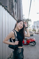 A woman wearing a black tank top