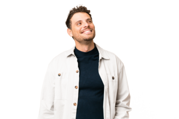 Brazilian man over isolated chroma key background thinking an idea while looking up