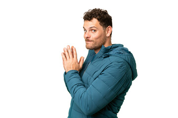 Brazilian man over isolated chroma key background scheming something
