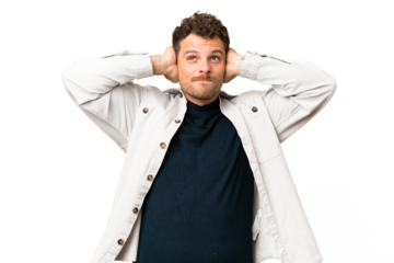 Brazilian man over isolated chroma key background frustrated and covering ears