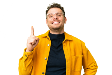 Brazilian man over isolated chroma key background showing and lifting a finger in sign of the best