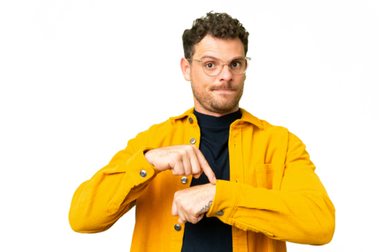 Brazilian man over isolated chroma key background making the gesture of being late