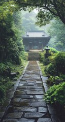 Misty path leading to a traditional temple in a lush Japanese garden