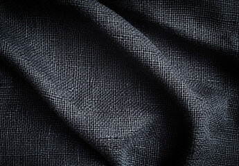 Fototapeta premium Close-up view of dark gray textured fabric with subtle pattern, showing soft folds and shadows, ideal for fashion or textile design projects. : Generative AI