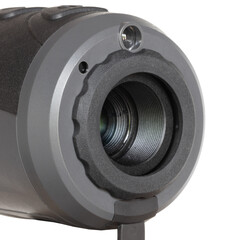 Objective lens and LED emitter up close on a thermal night vision monocular
