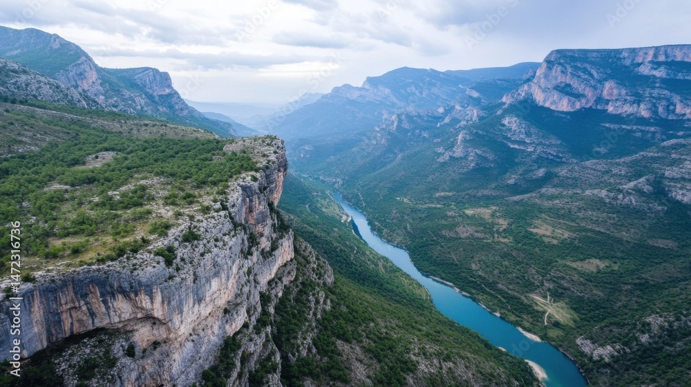 Aufkleber a stunning aerial view showcases a dramatic river winding through a deep canyon, surrounded by lush 