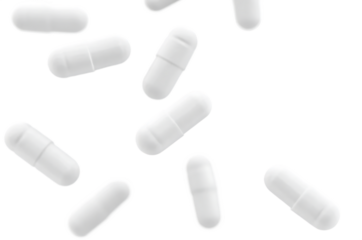 White Capsules Falling on Black Background Medical Pharmacy Healthcare Supplements