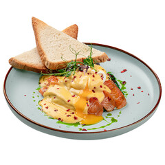 Isolated portion of egg benedict with salmon and toasts