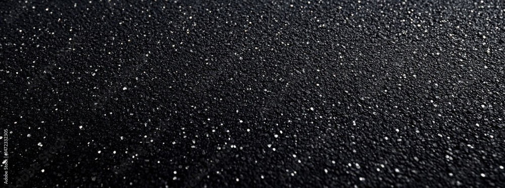 Fototapete close-up view of a textured black surface with tiny, glittering particles, creating a luxurious and 