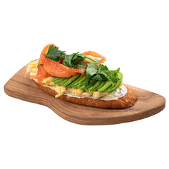 Isolated breakfast toast with salmon and avocado on wooden board