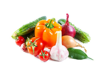 Mix of colorful vegetables - bell pepper, tomatoes, cucumbers, onions and garlic.