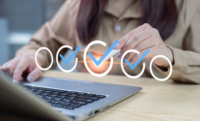 Businesswomen use online checkboxes on virtual screens for evaluation, Conduct online evaluation surveys, select correct answers, test questions, online tests, knowledge tests, and complete surveys.