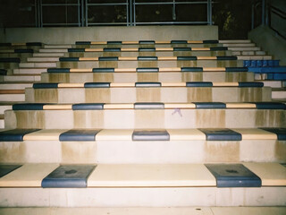 Urban wildlife a rat on stadium bleachers during empty soccer game day in an abandoned environment